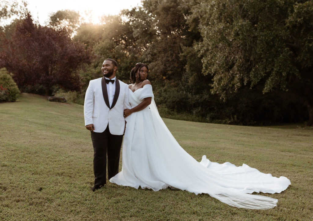 Bride and groom celebrate their wedding at Camellia Gardens in Charlotte North Carolina