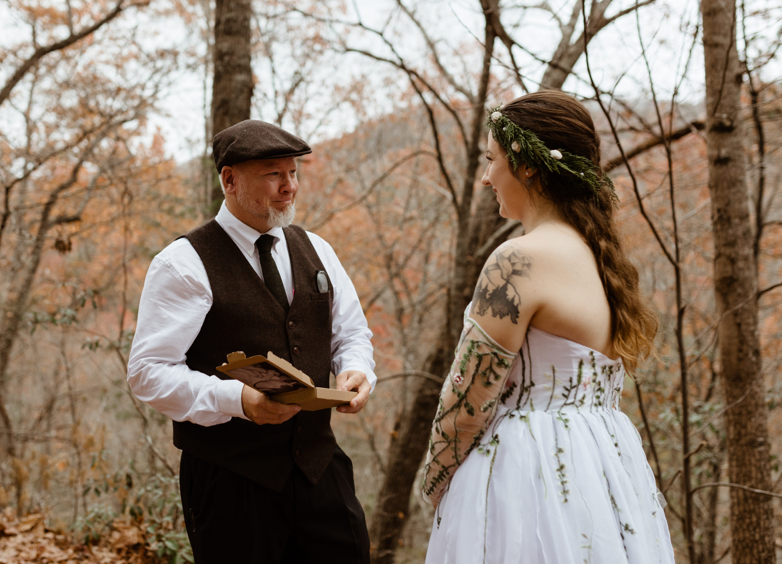 The bride gives her father a gift at her wedding in the blue ridge mountains of Asheville