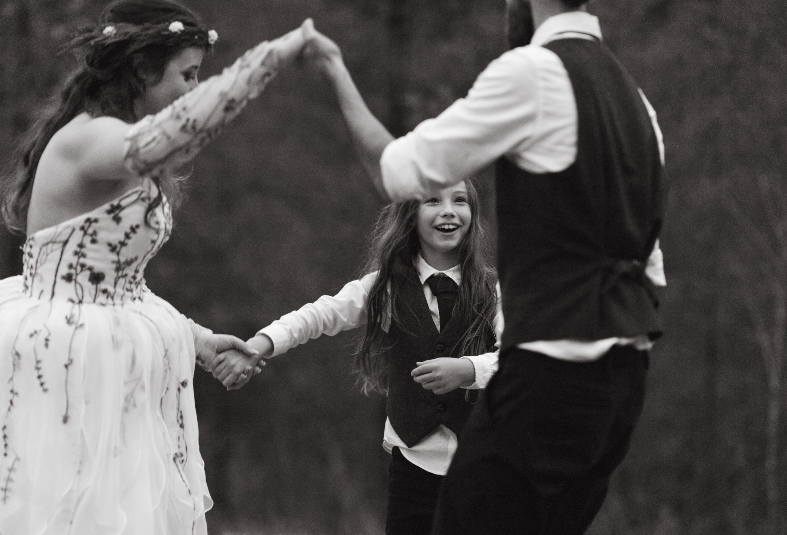 Bride, groom and son dancing at their reception for their blue ridge mountain wedding