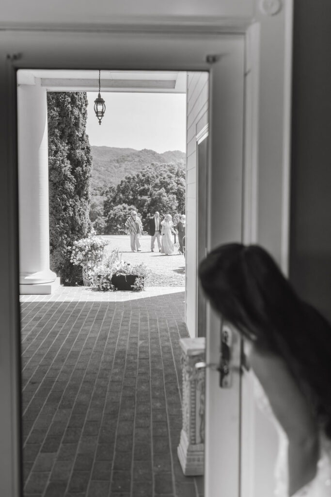 Bride prepares for wedding ceremony as guests arrive