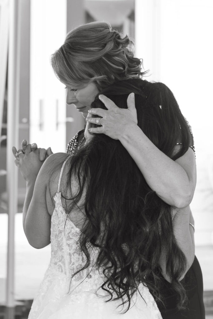 Emotional mother-daughter dance at a documentary wedding photographed in Wilmington, NC