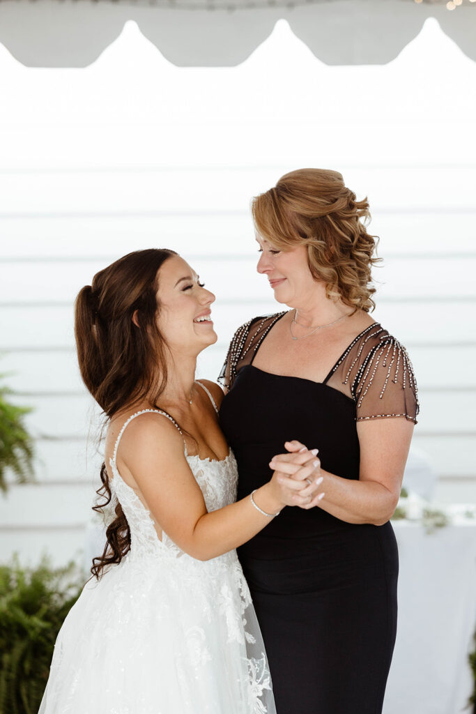Emotional mother-daughter dance at a documentary wedding photographed in Wilmington, NC