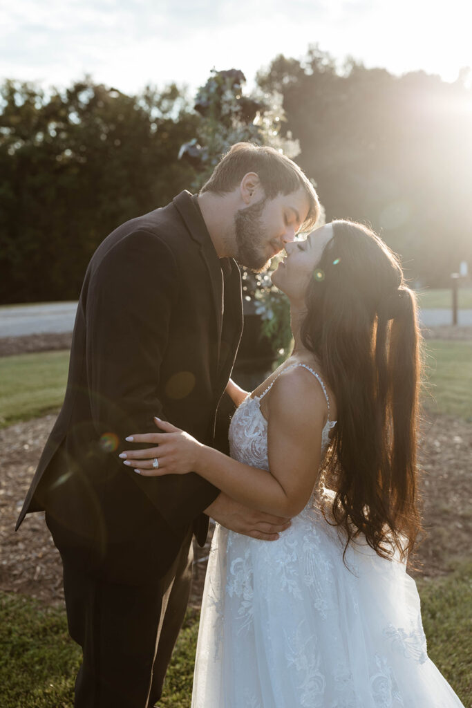 Sunset silhouette of couple embracing during a North Carolina wedding