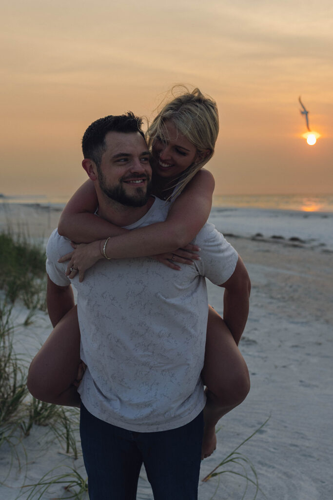 Candid couple photo during a sunrise session with Wrightsville Beach couples photographer